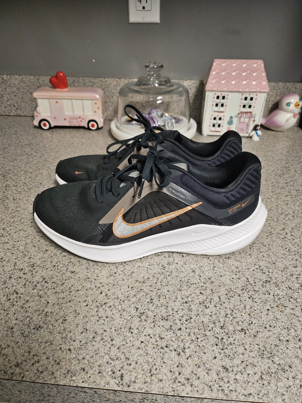 Nike Women's Black Running Shoes with Metallic Orange Swoosh